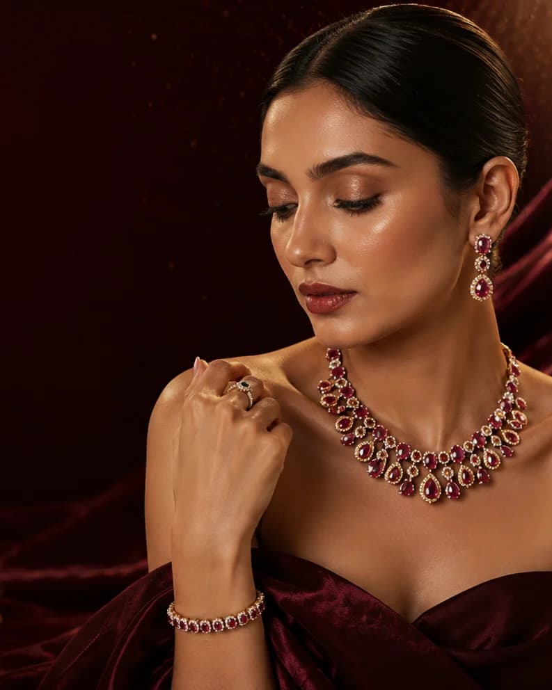 Necklace and earring sets on display — Qamar Jewels